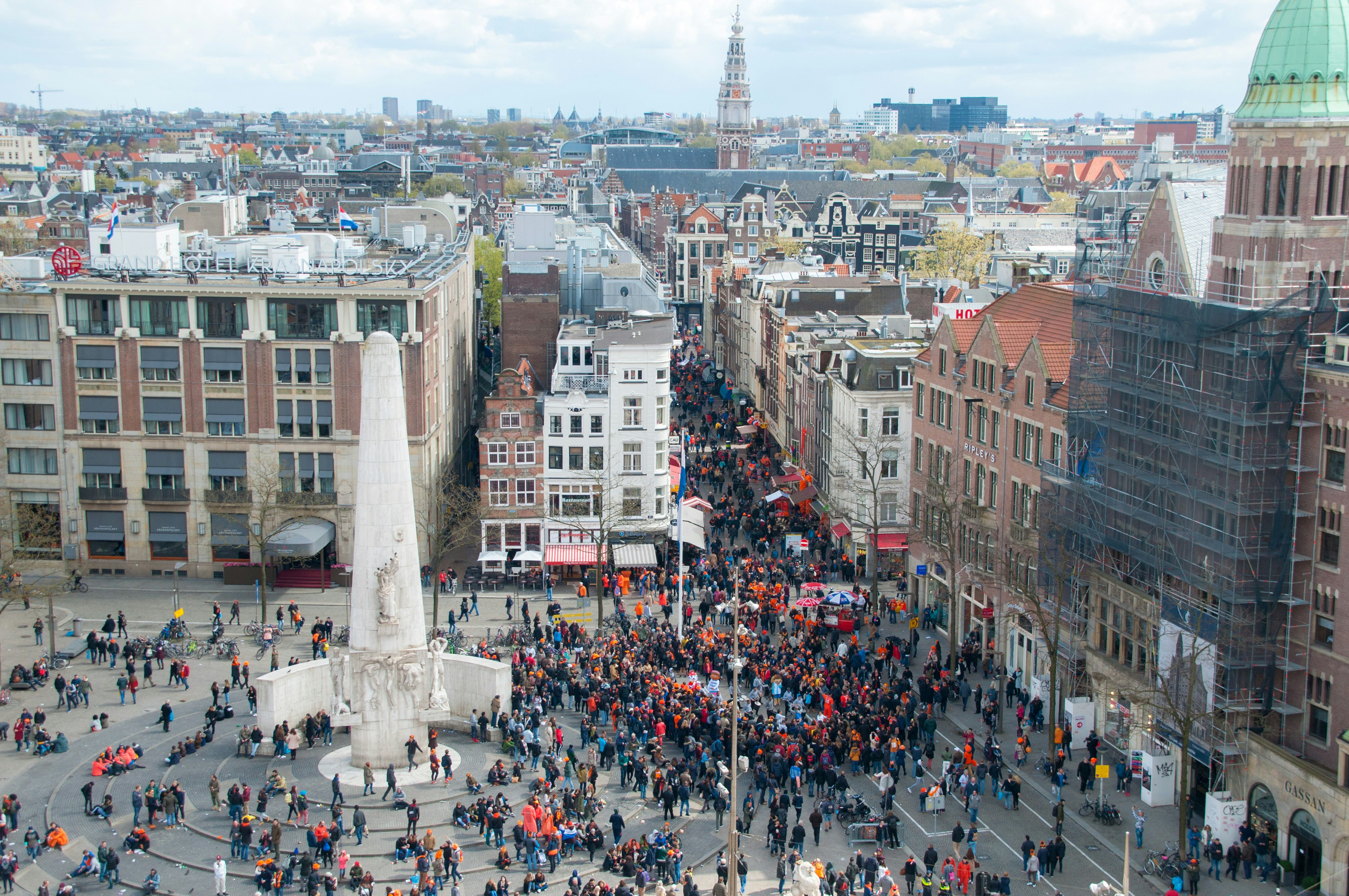 7 Overlooked European Cities That Offer Big Culture Without the Crowds – a crowd of people standing on top of a tall building