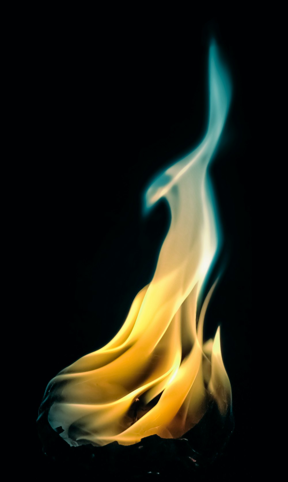 a close up of a fire on a black background