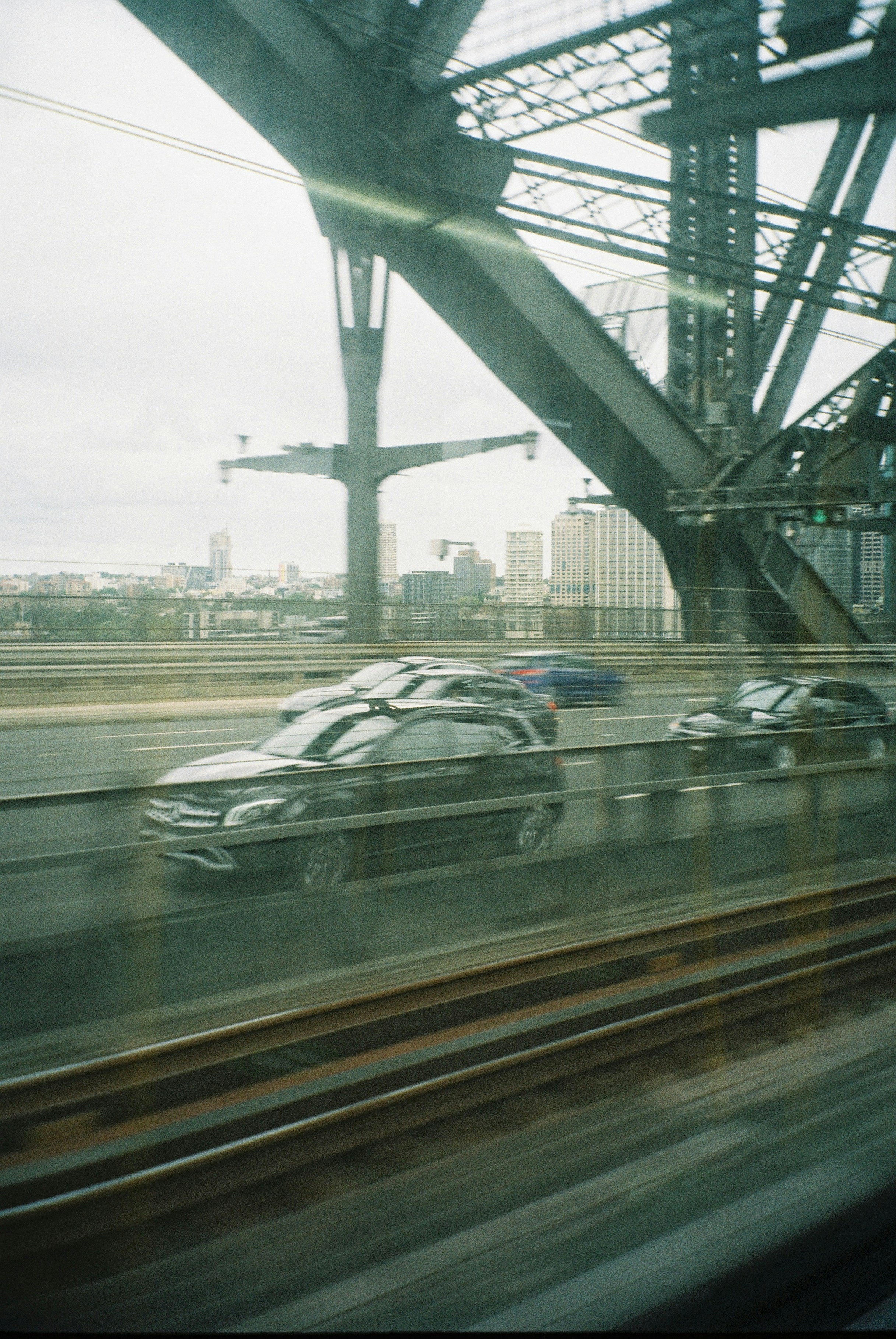 a view of a city from a moving train