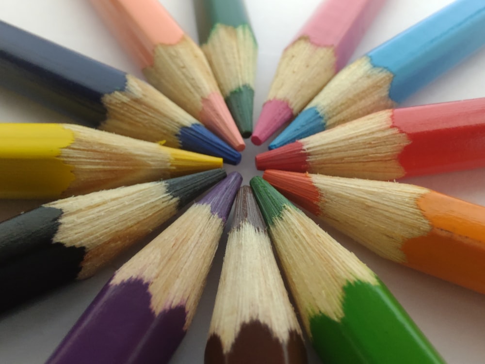 a group of colored pencils arranged in a circle