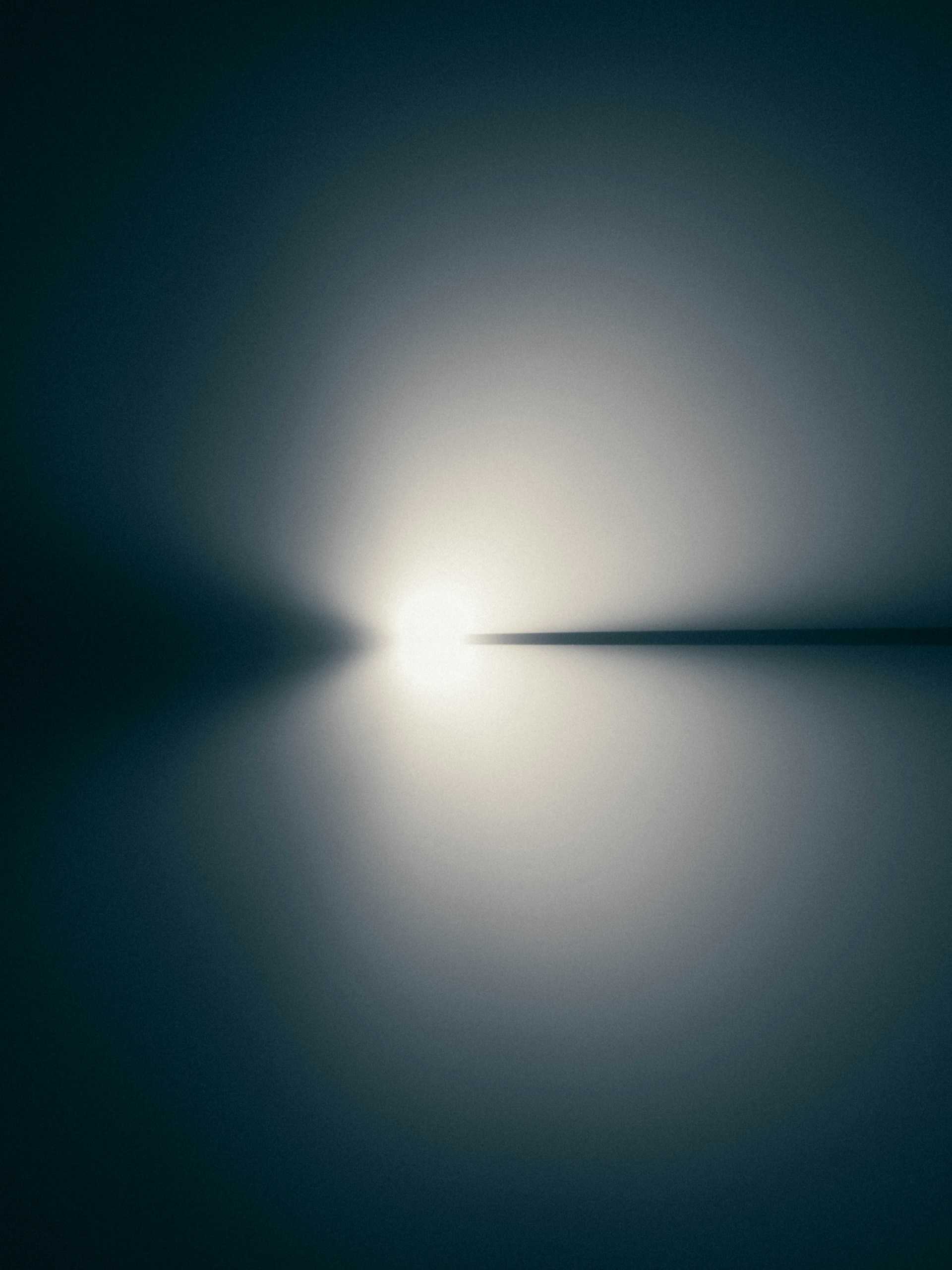 the light is shining through the fog in the dark