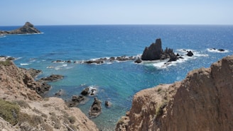 a view of the ocean from the top of a hill