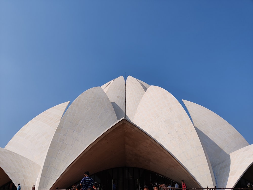 a group of people standing outside of a building