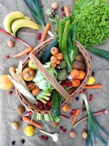 a basket filled with lots of different types of vegetables