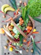 a basket filled with lots of different types of vegetables