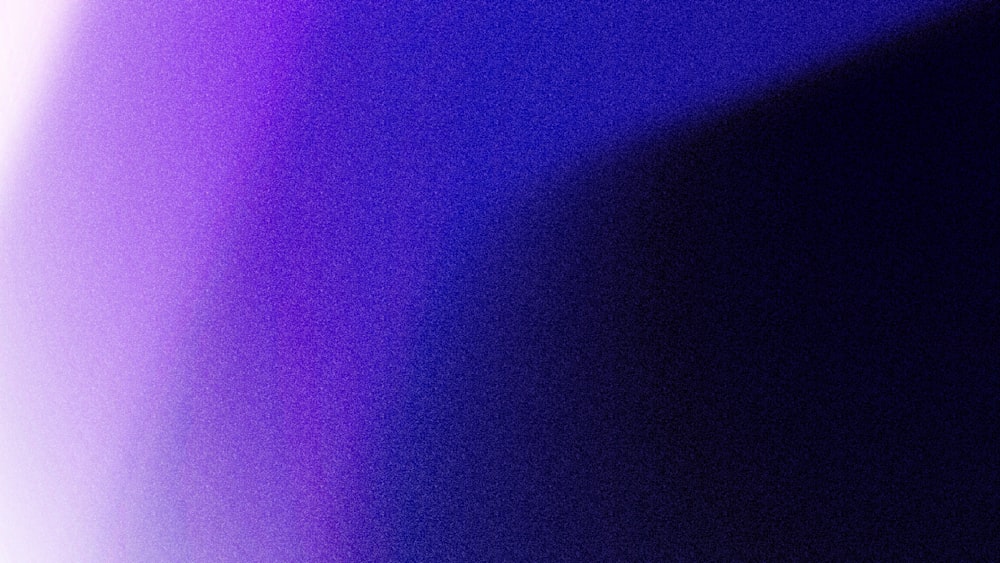 a blurry image of a purple and blue background