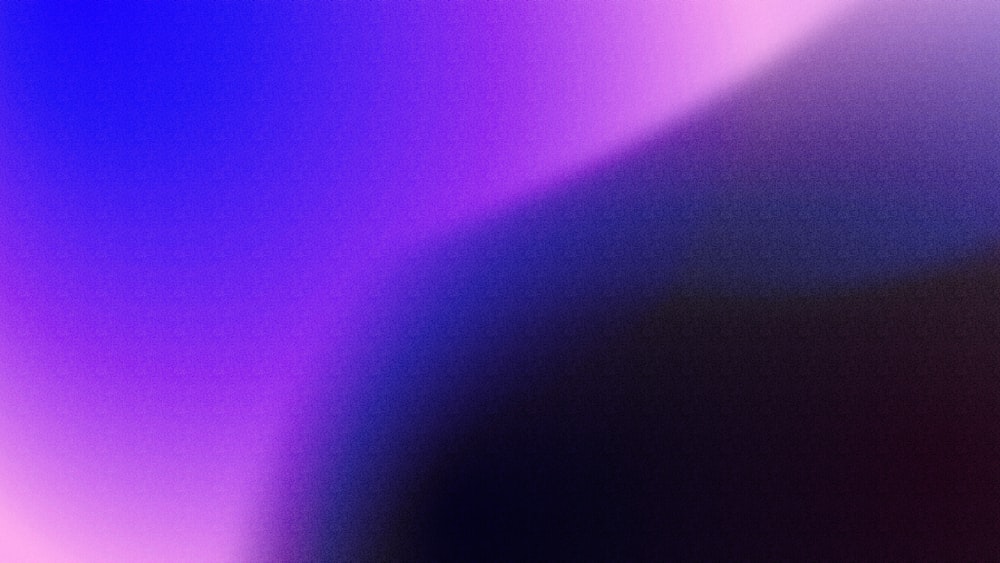 a blurry image of a purple and blue background