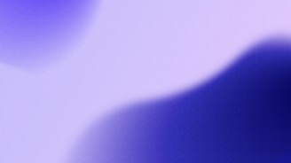 a blurry image of a cell phone with a blurry background
