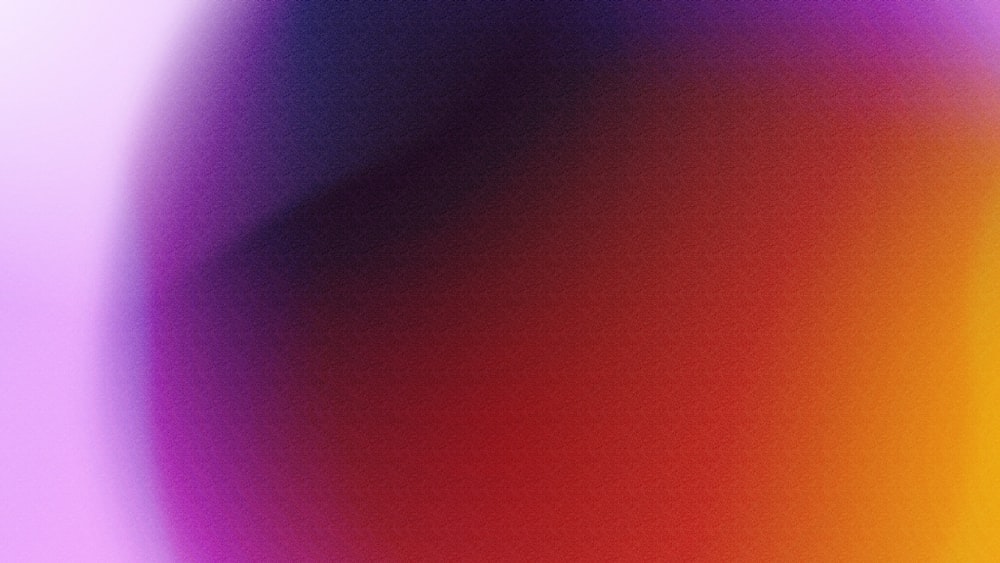 a blurry image of a purple and red background