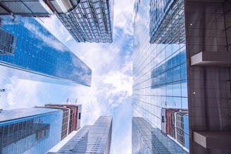 looking up at tall buildings in a city