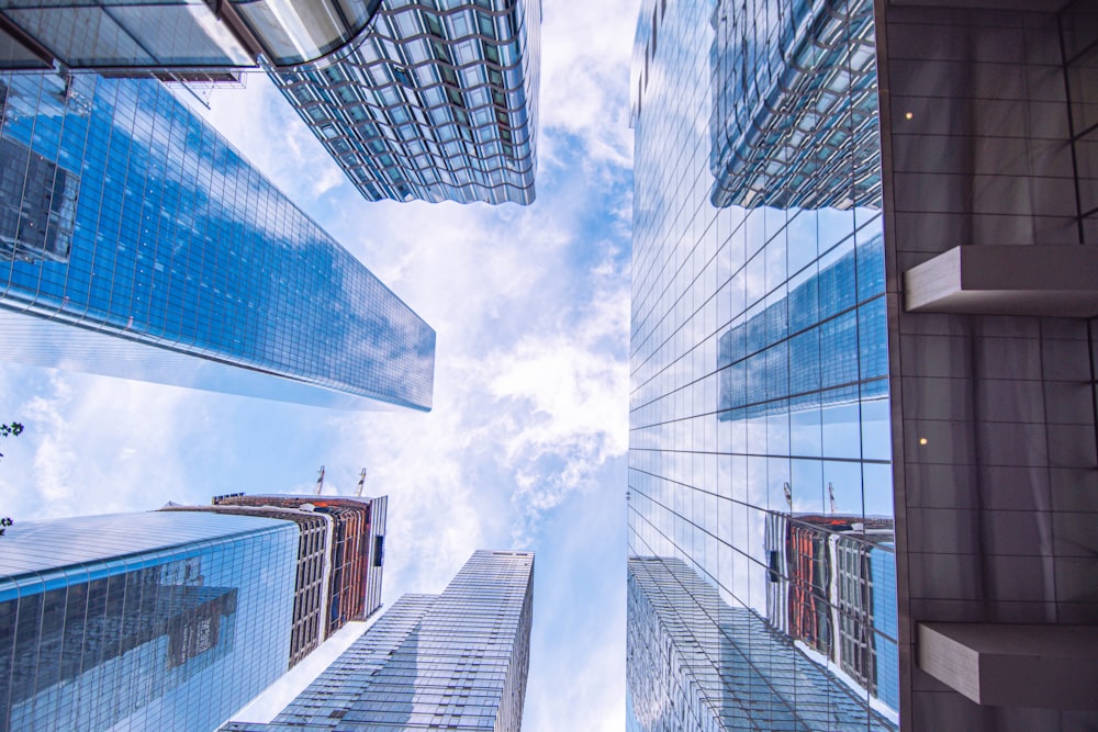 looking up at tall buildings in a city