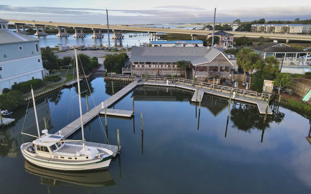 a boat is docked at a dock in the water