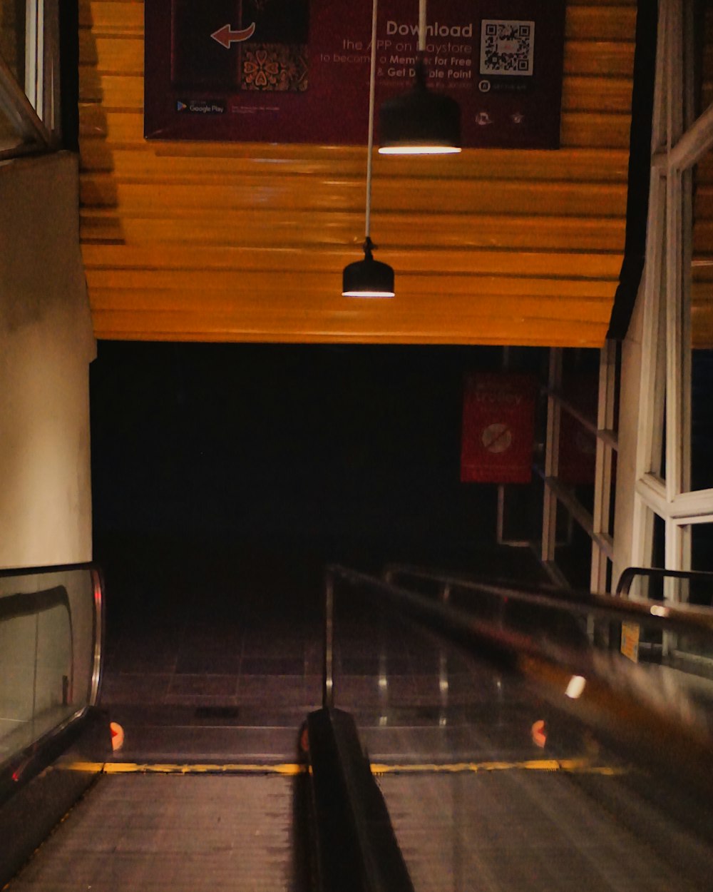 an escalator in a subway station at night