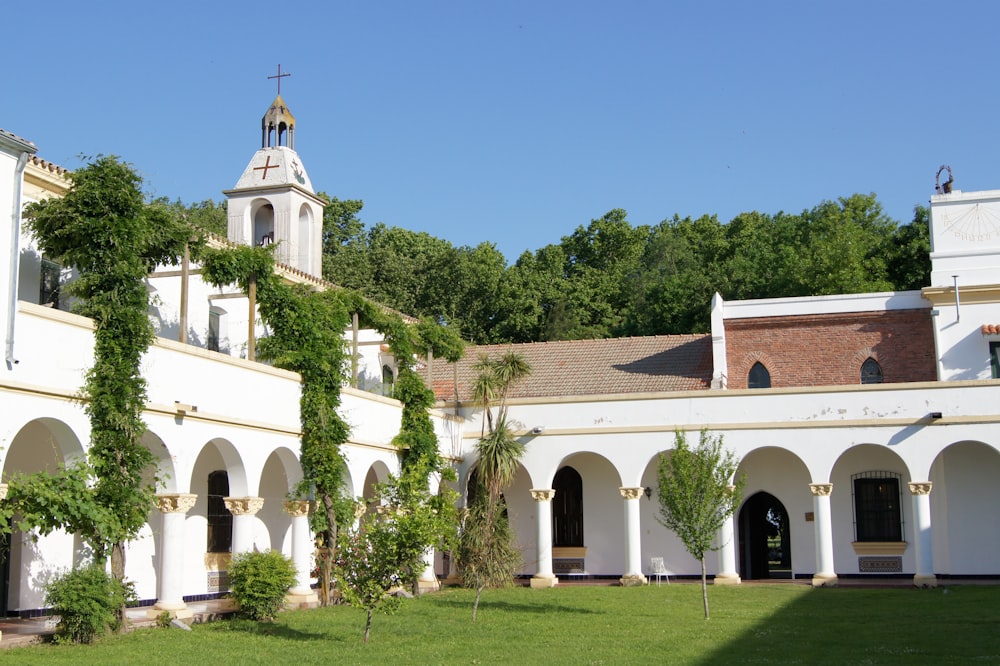 a white building with a clock tower on top of it