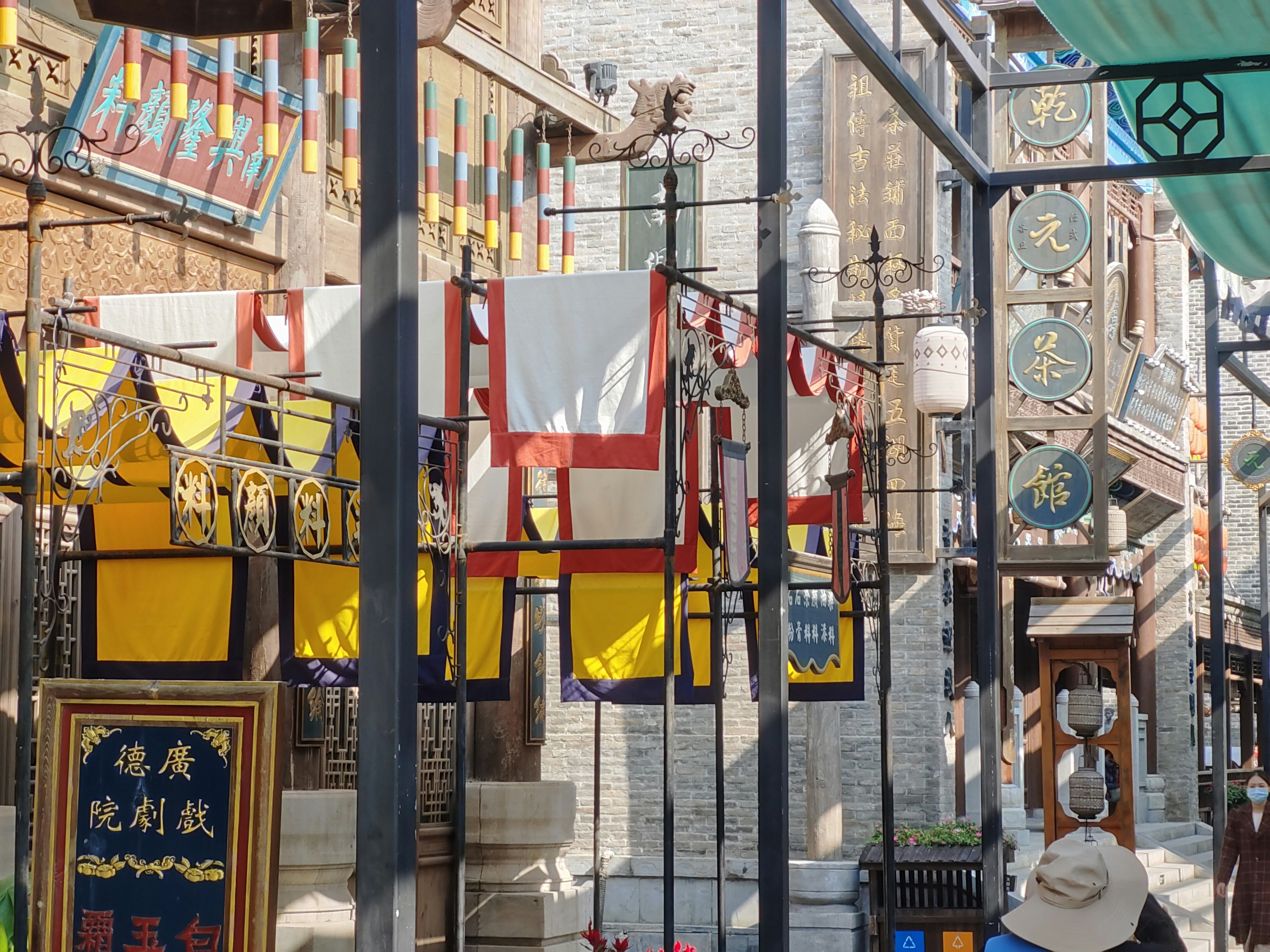 a group of signs hanging from the side of a building