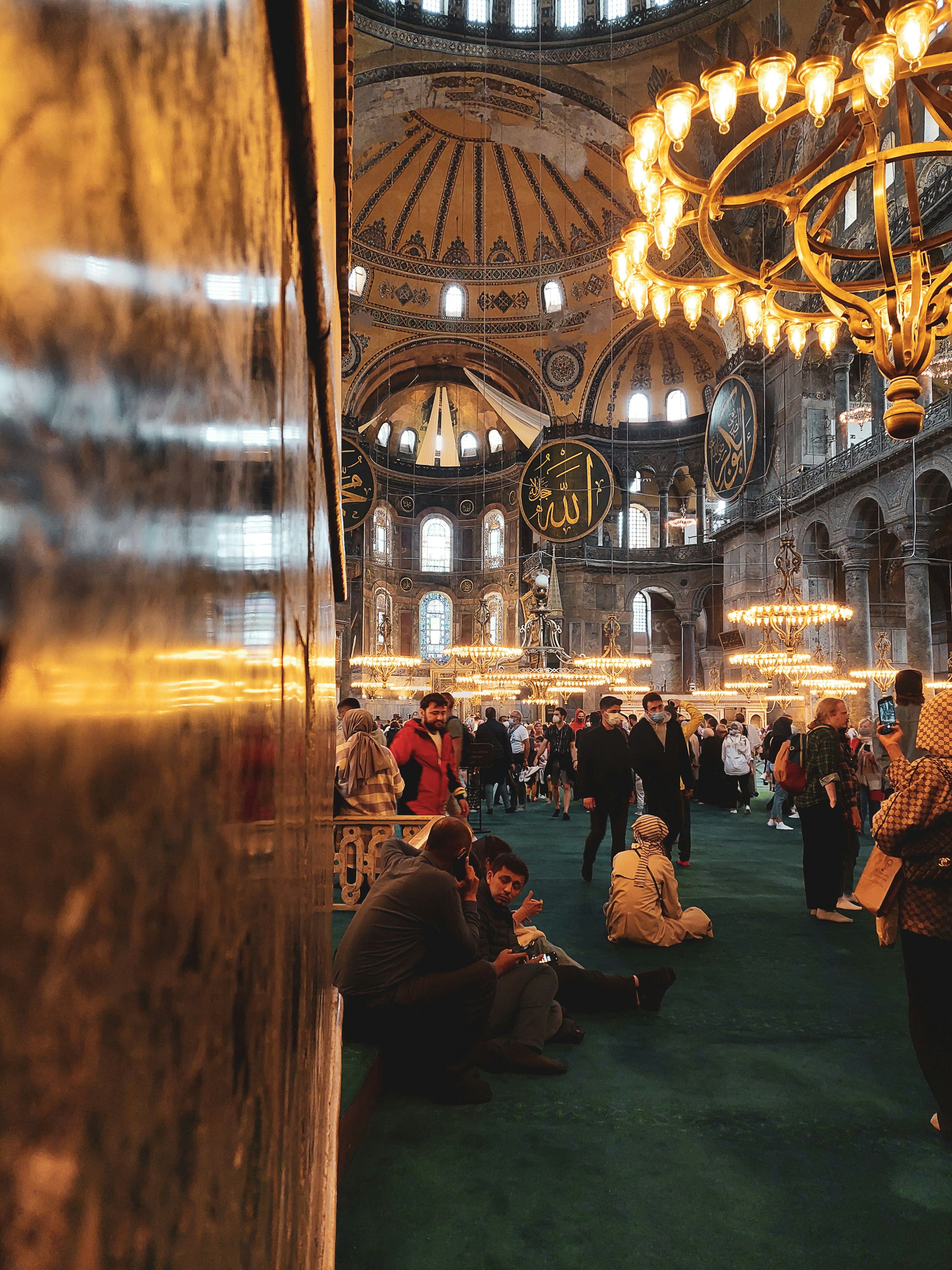 a group of people sitting on the floor of a building