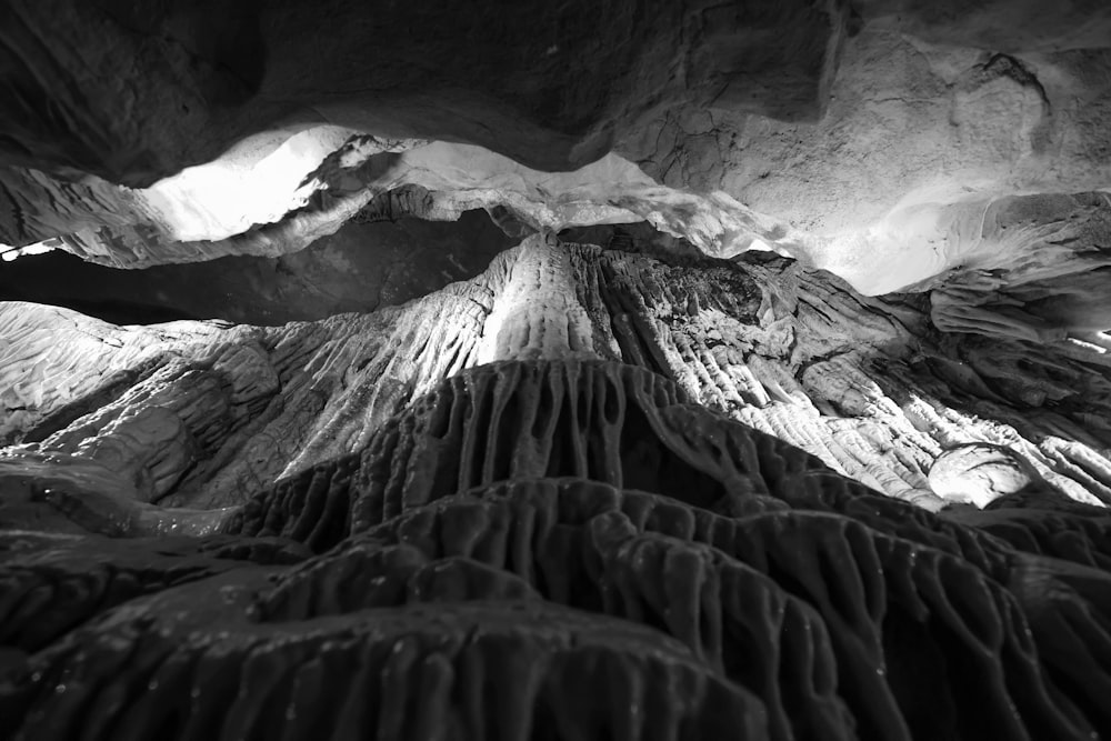 a black and white photo of the inside of a cave