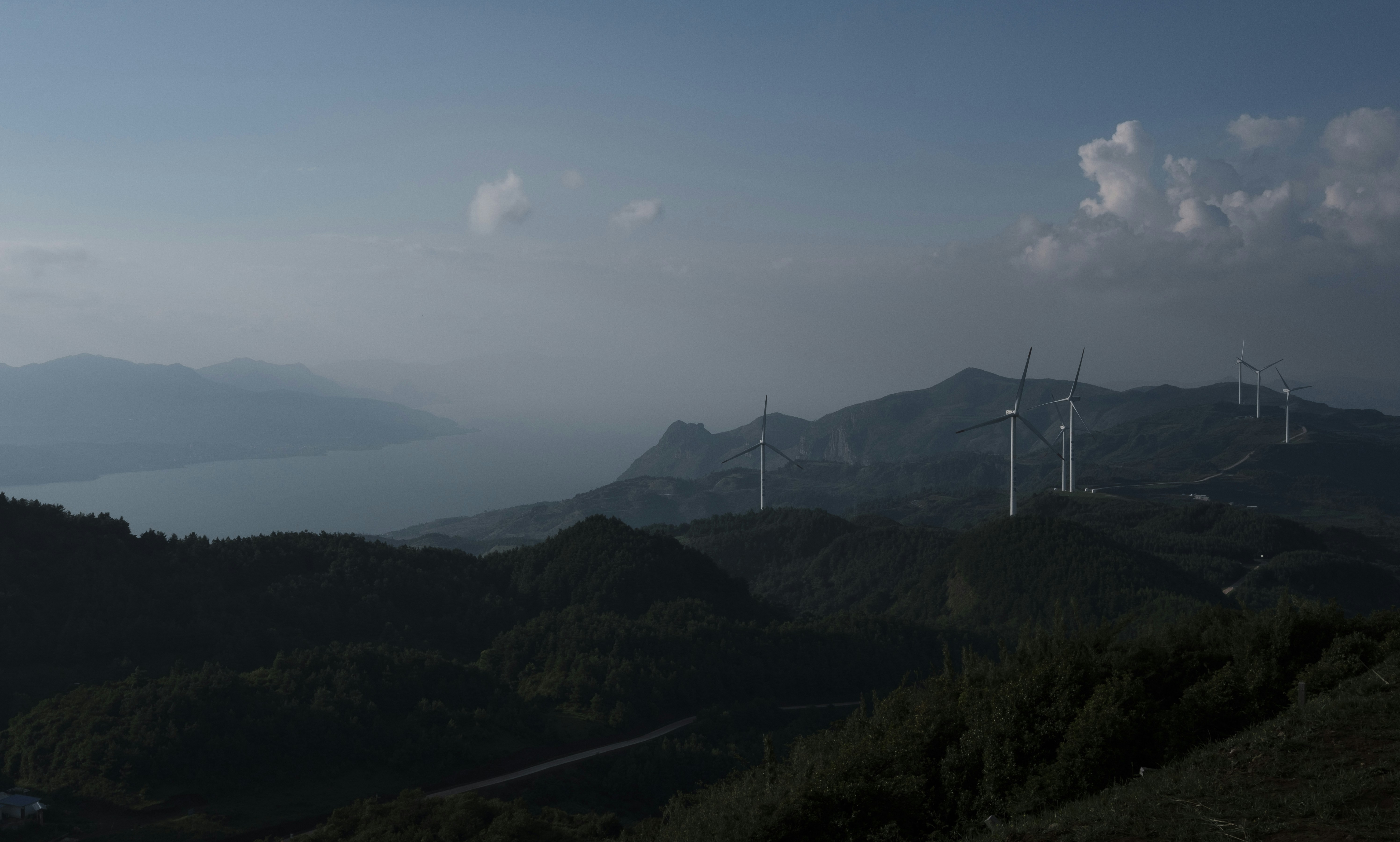 A group of wind turbines on a hill photo – Free Scenery Image on Unsplash