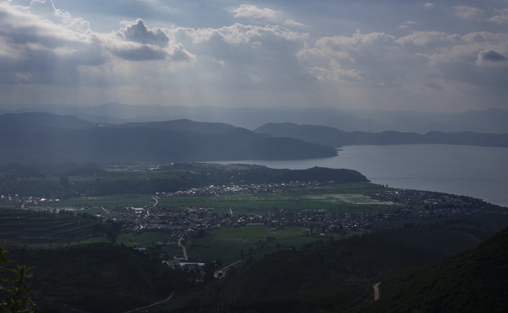 a view of a town and a body of water