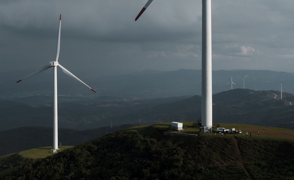 a wind turbine on top of a hill