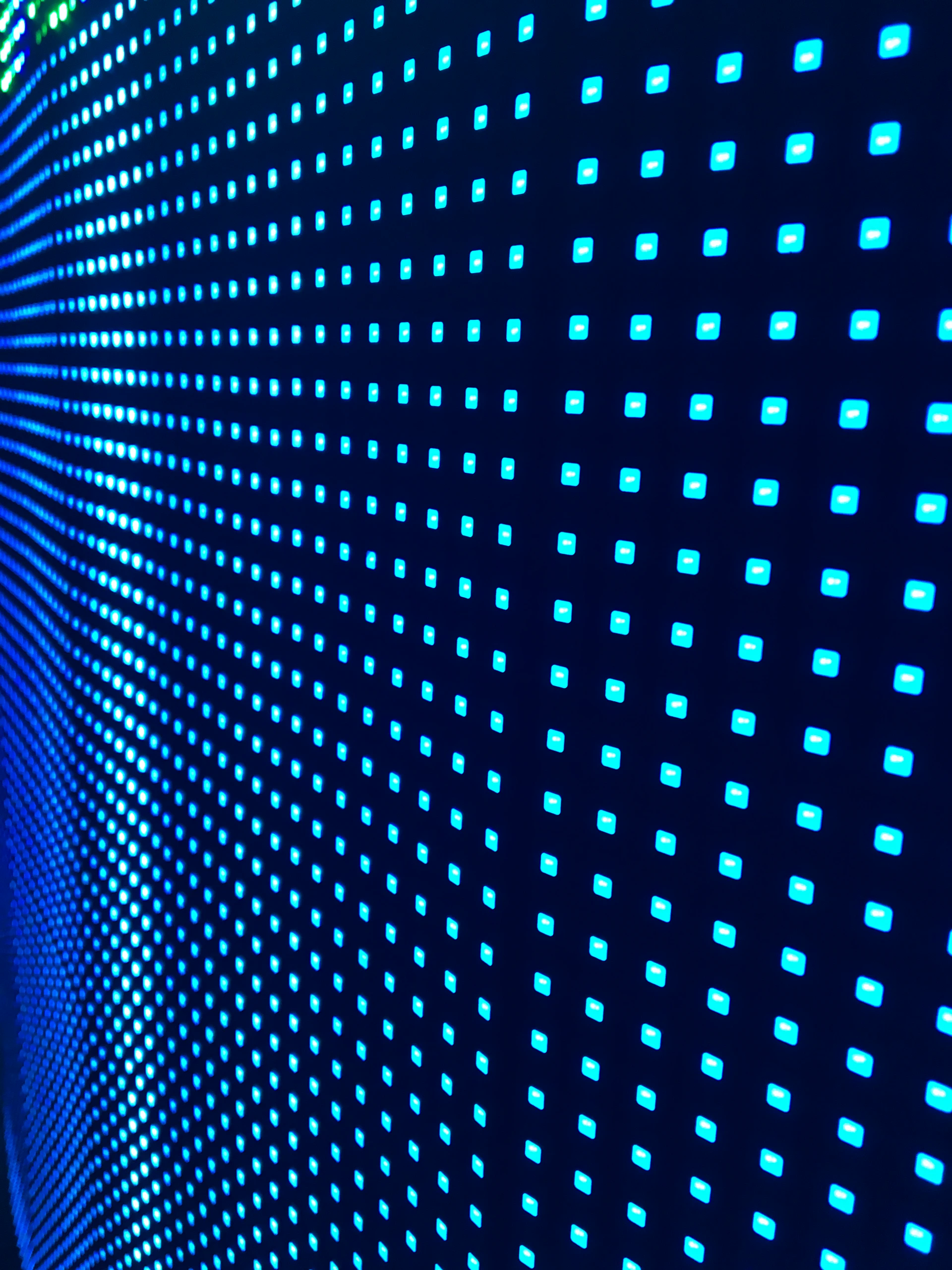 a wall with a lot of blue squares on it