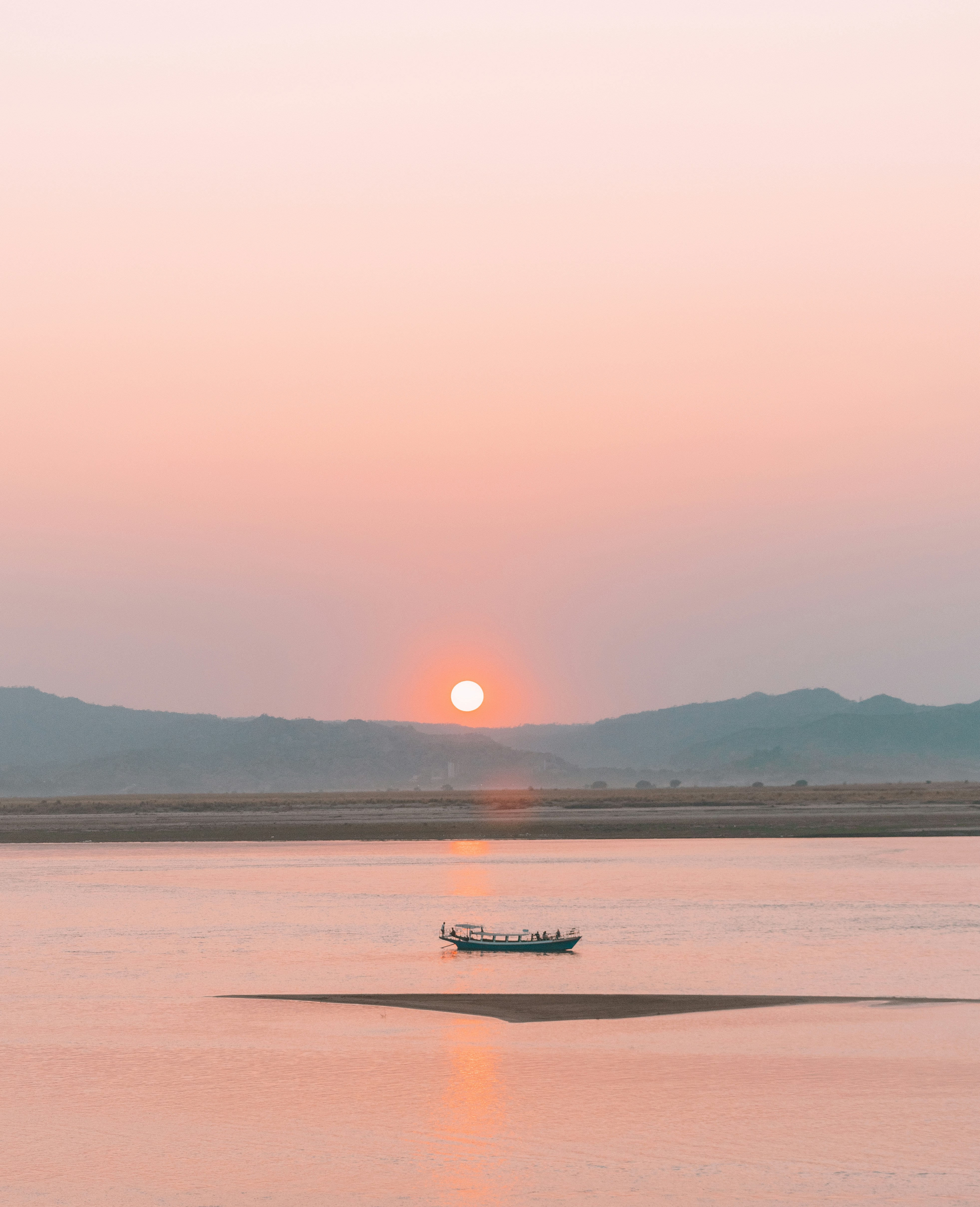 a boat floating on top of a large body of water