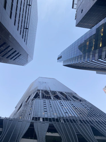 looking up at the top of a tall building
