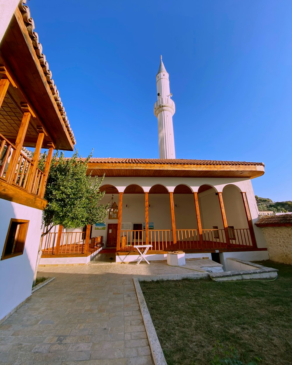 a building with a clock tower in the background