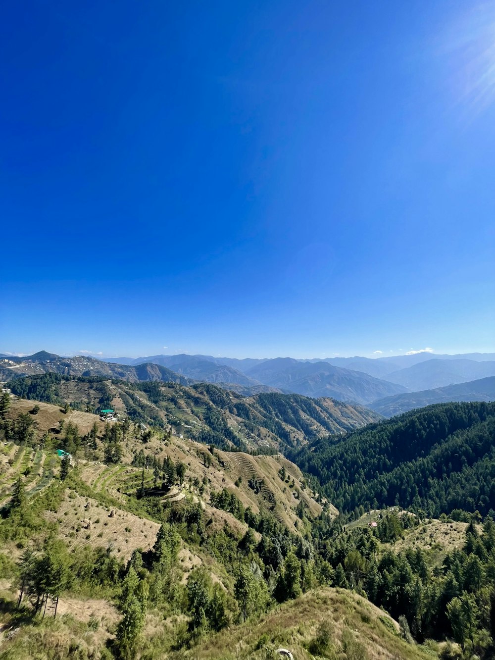 a view of a mountain range with a blue sky