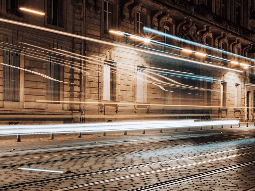 a blurry photo of a train track in front of a building