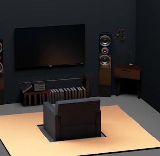 a living room with a flat screen tv and speakers