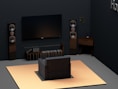 a living room with a flat screen tv and speakers