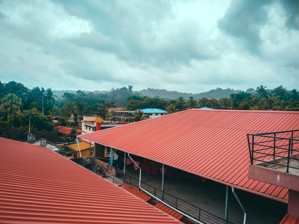 the roof of a building with a red tin roof