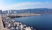a large body of water next to a city