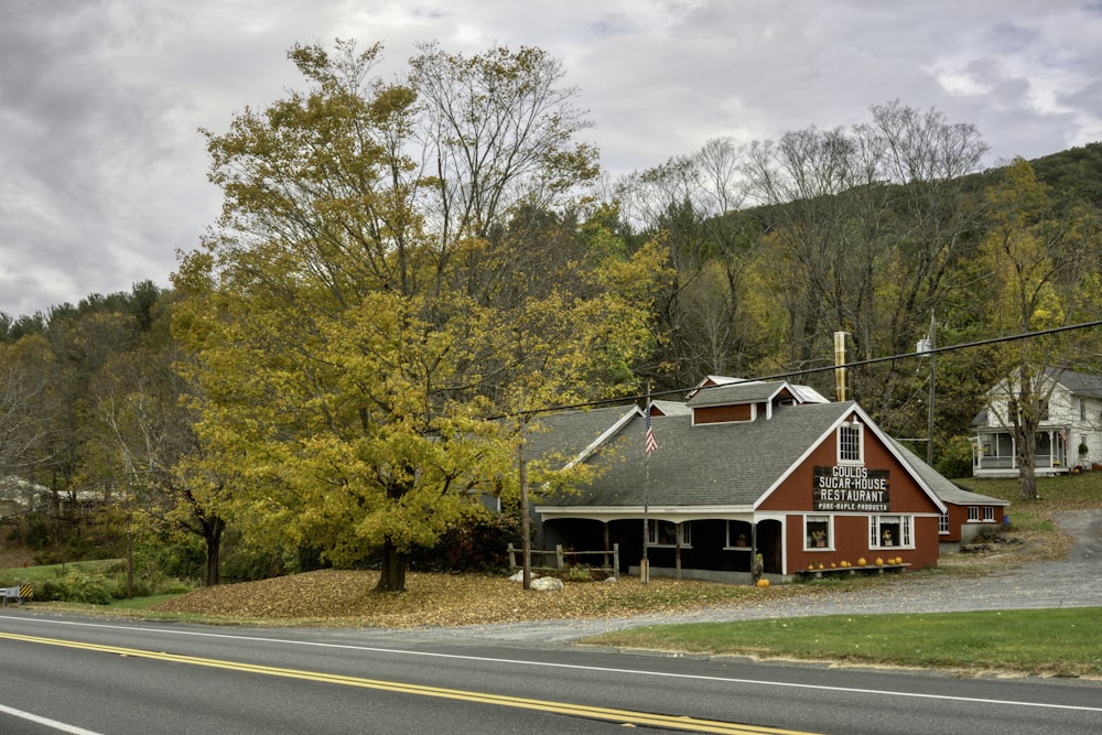 a red building sitting on the side of a road