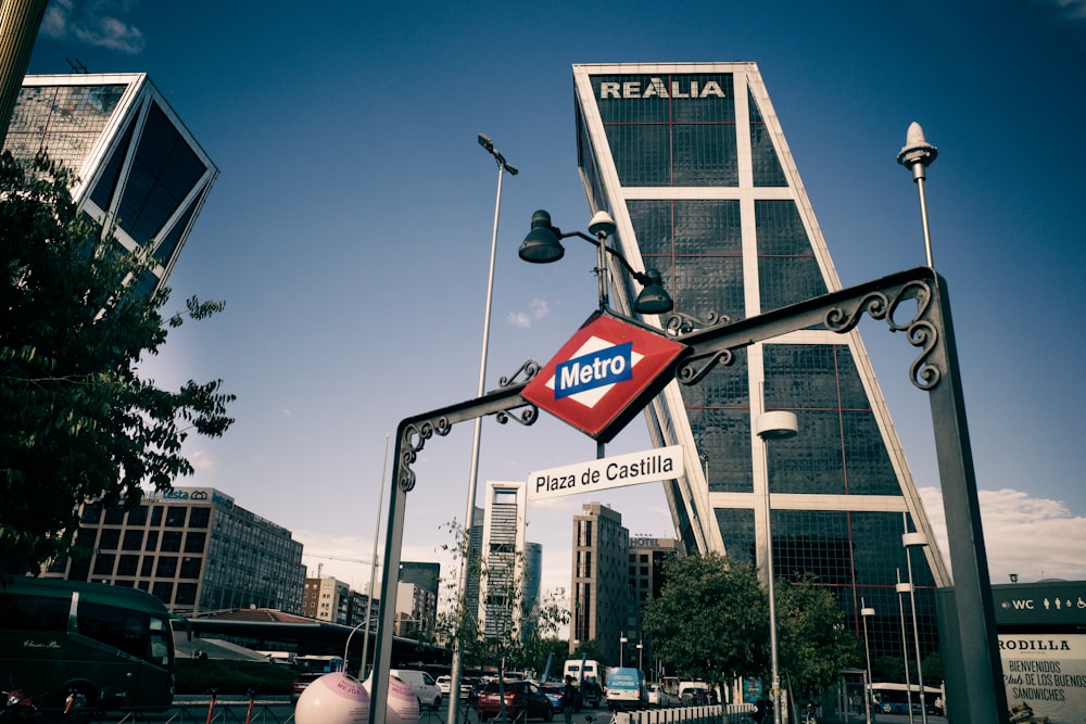 a street sign in front of a tall building