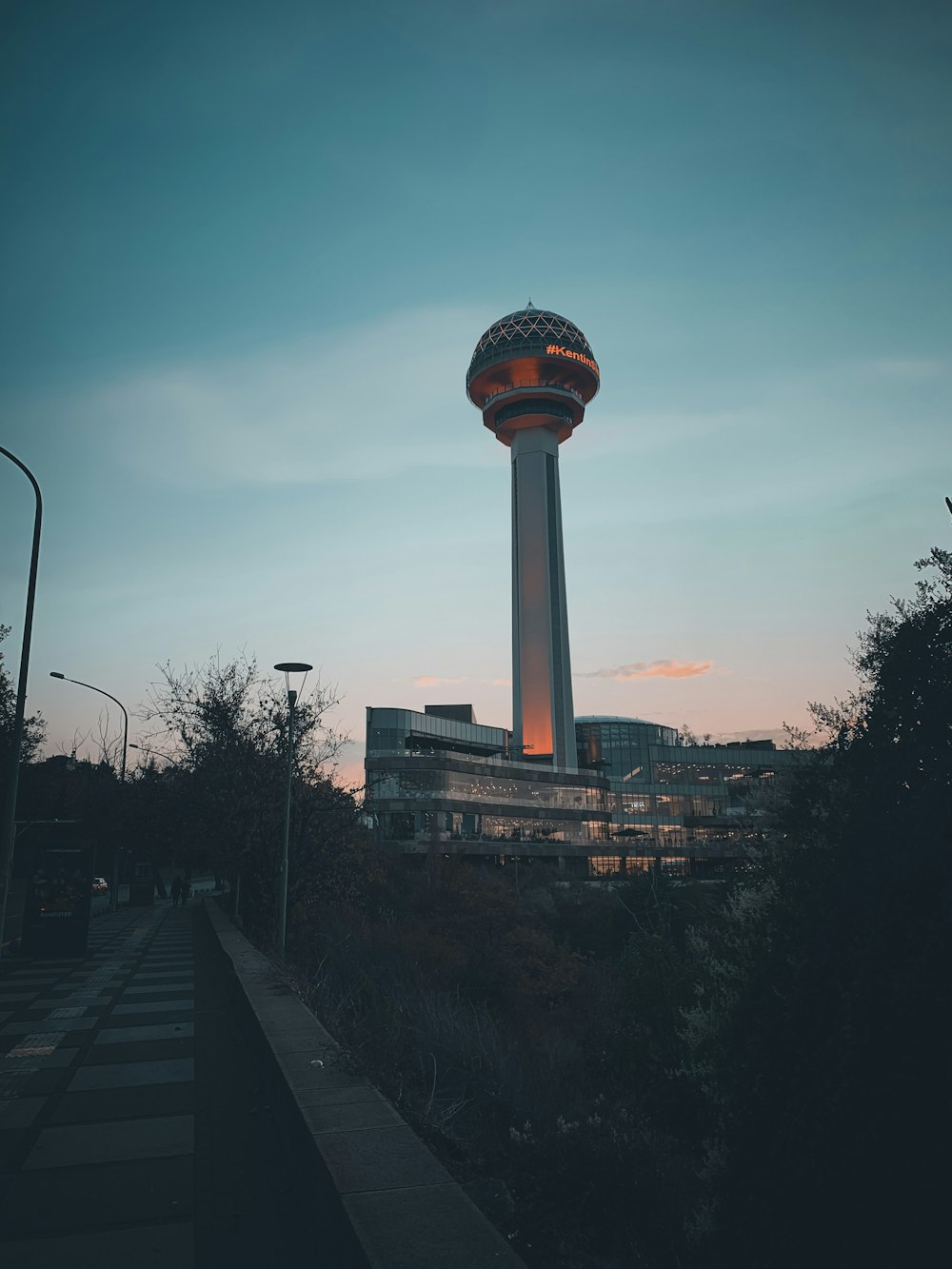 a tall tower with a light on top of it