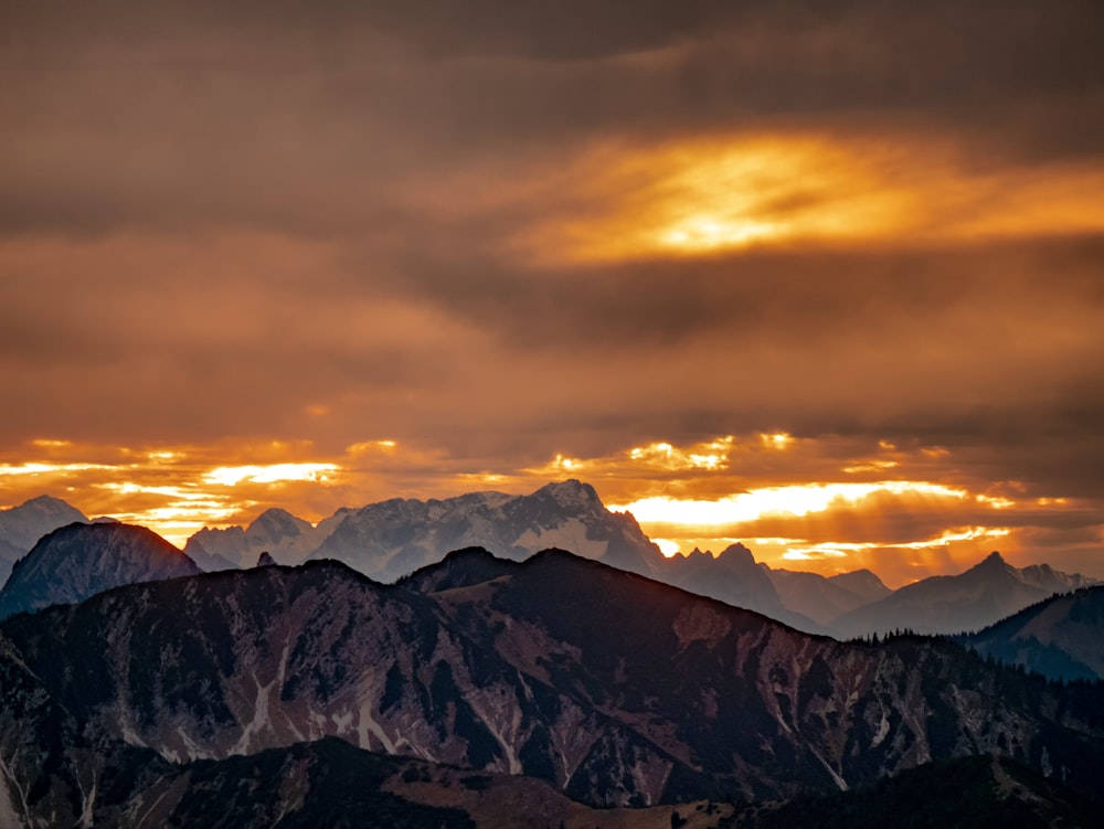 a view of a mountain range at sunset