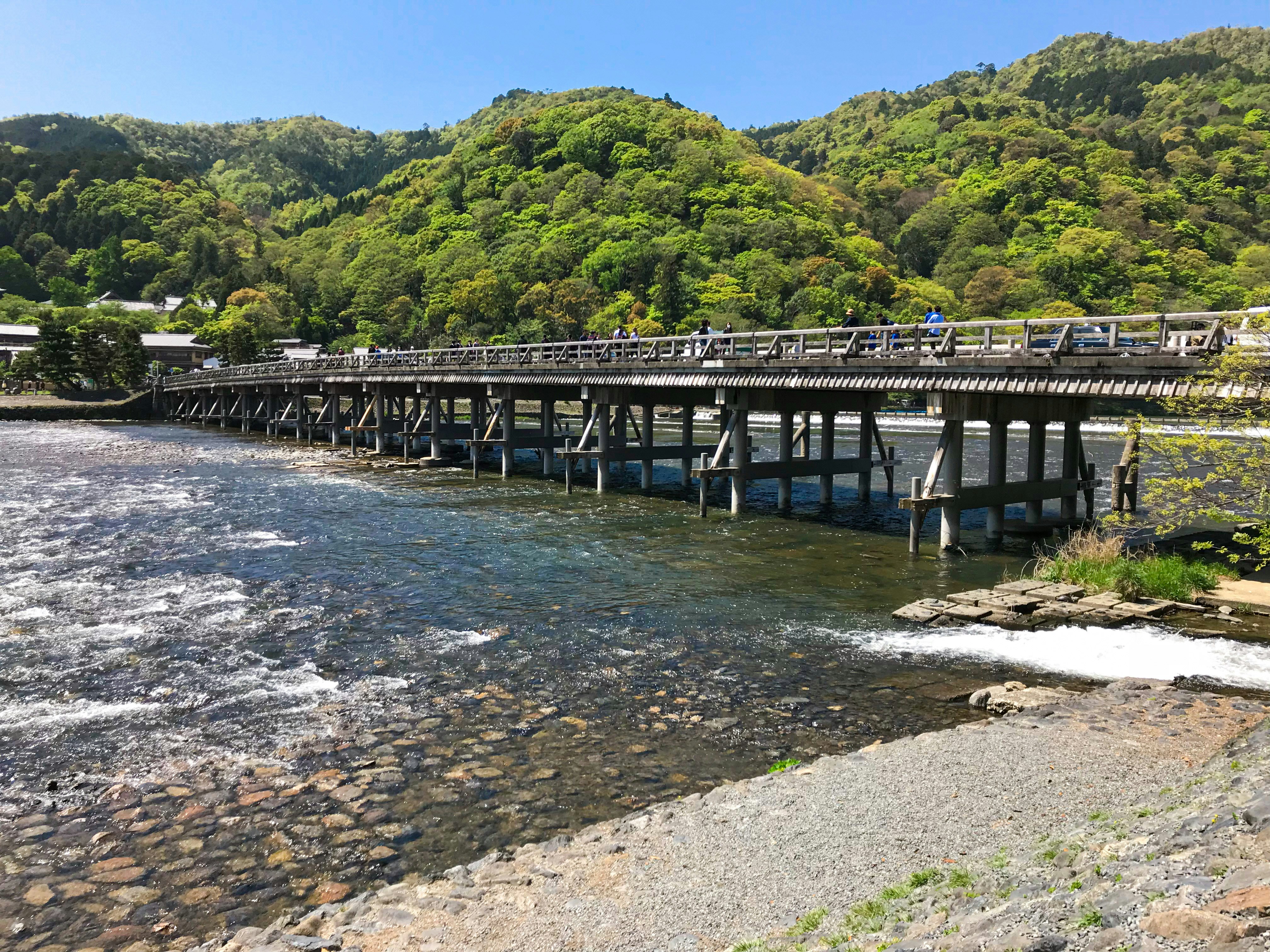 a bridge over a river with cars on it