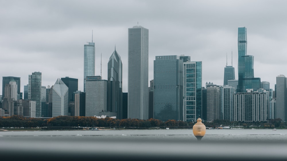 a large body of water with a city in the background