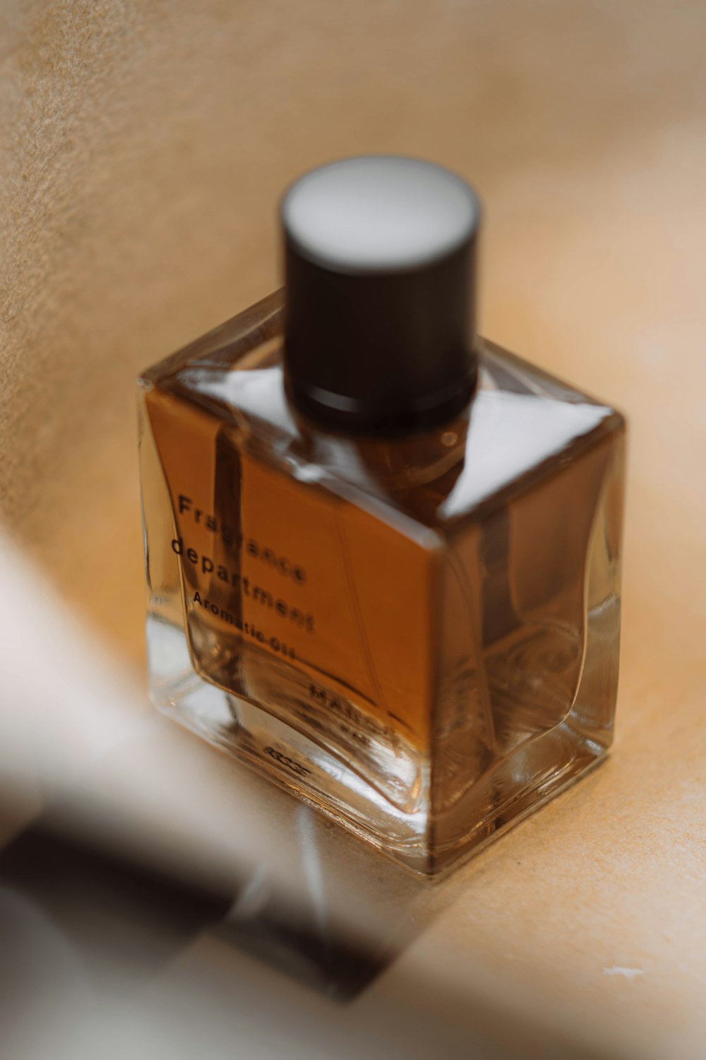 a bottle of perfume sitting on a counter