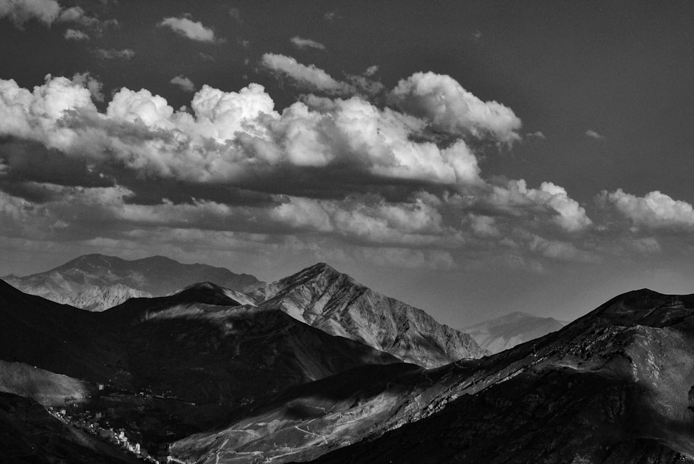 a black and white photo of a mountain range