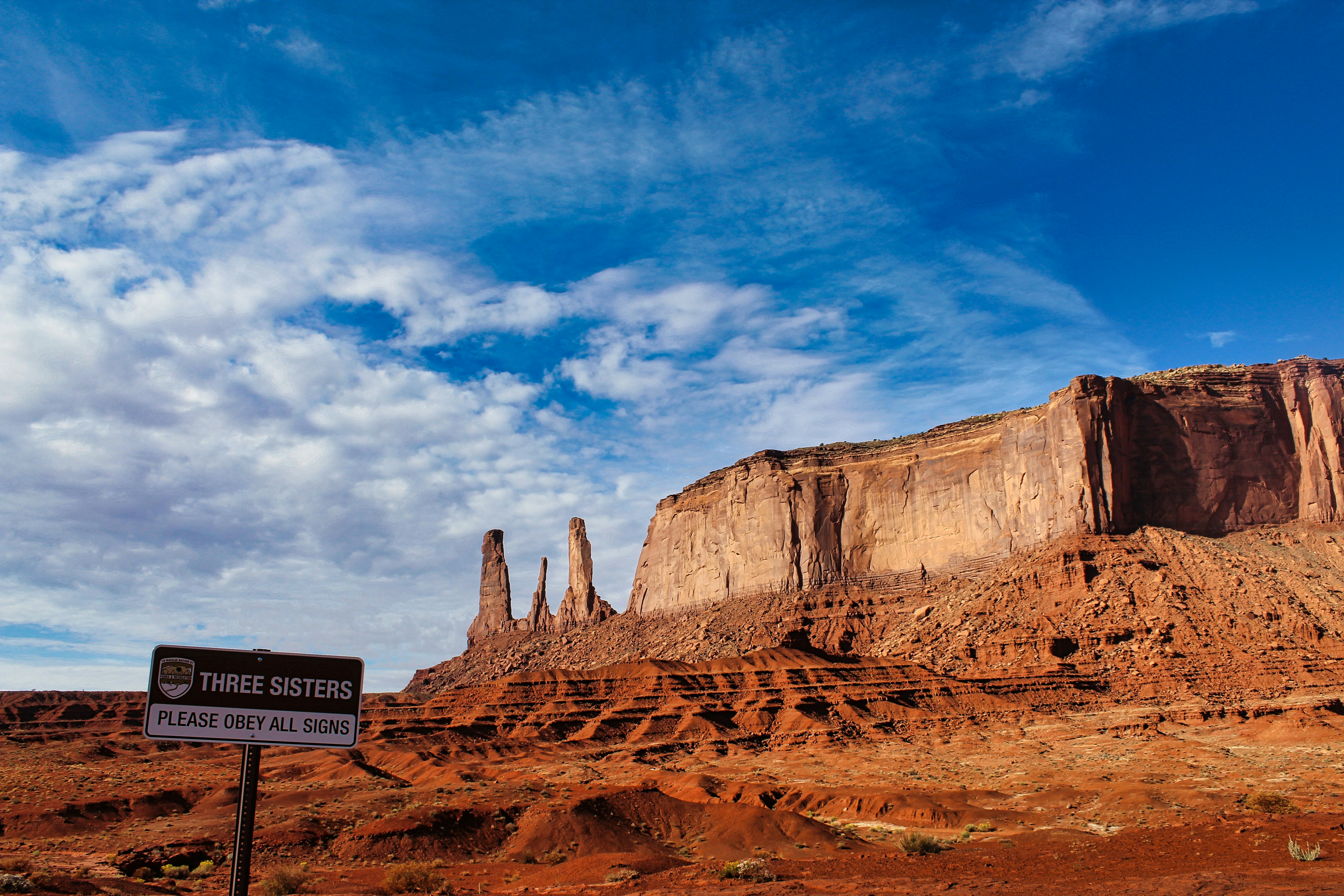 a road sign in the middle of a desert