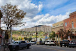 a city street with a mountain in the background
