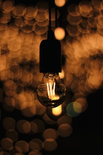 An innovative smart light bulb illuminating a cozy living room.