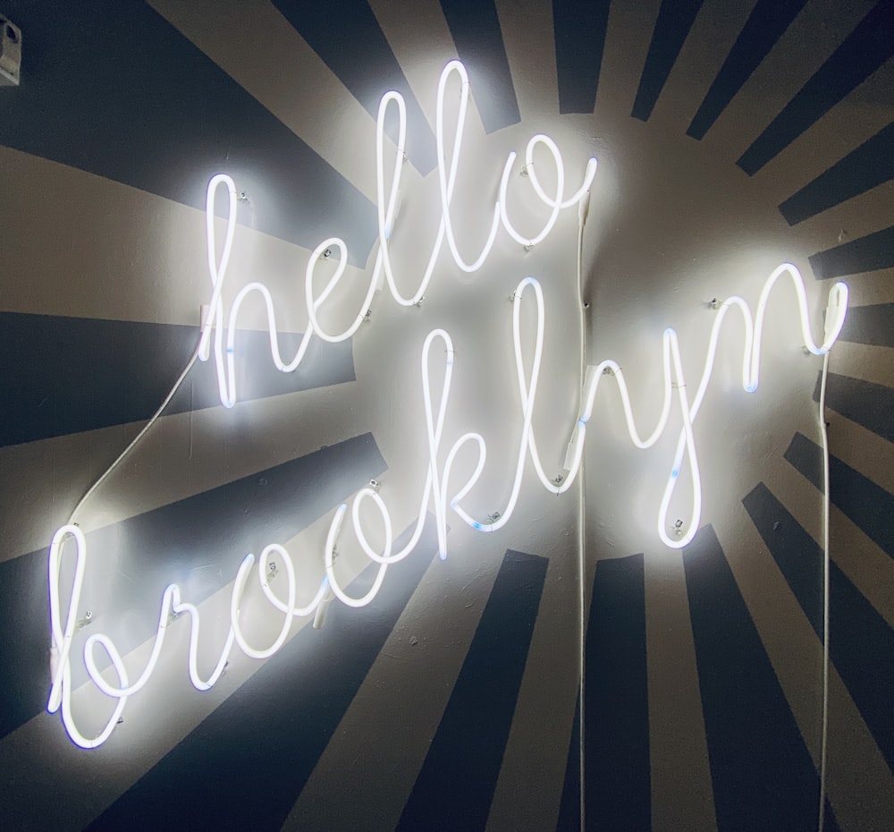 a neon sign that reads hello brooklyn