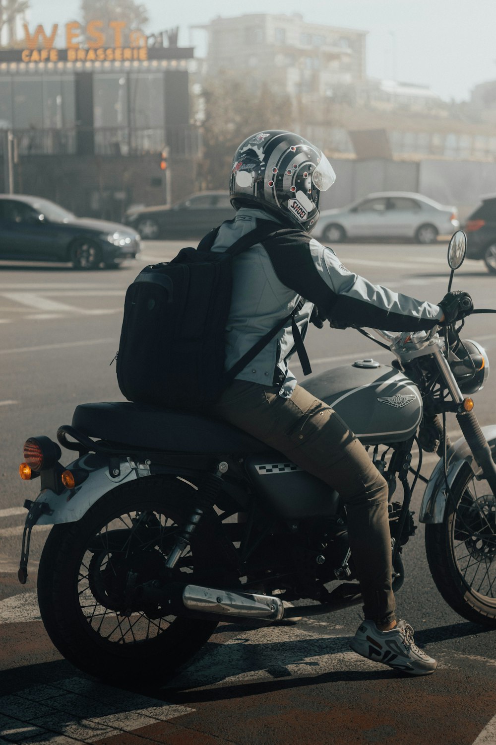 a man riding a motorcycle on a city street