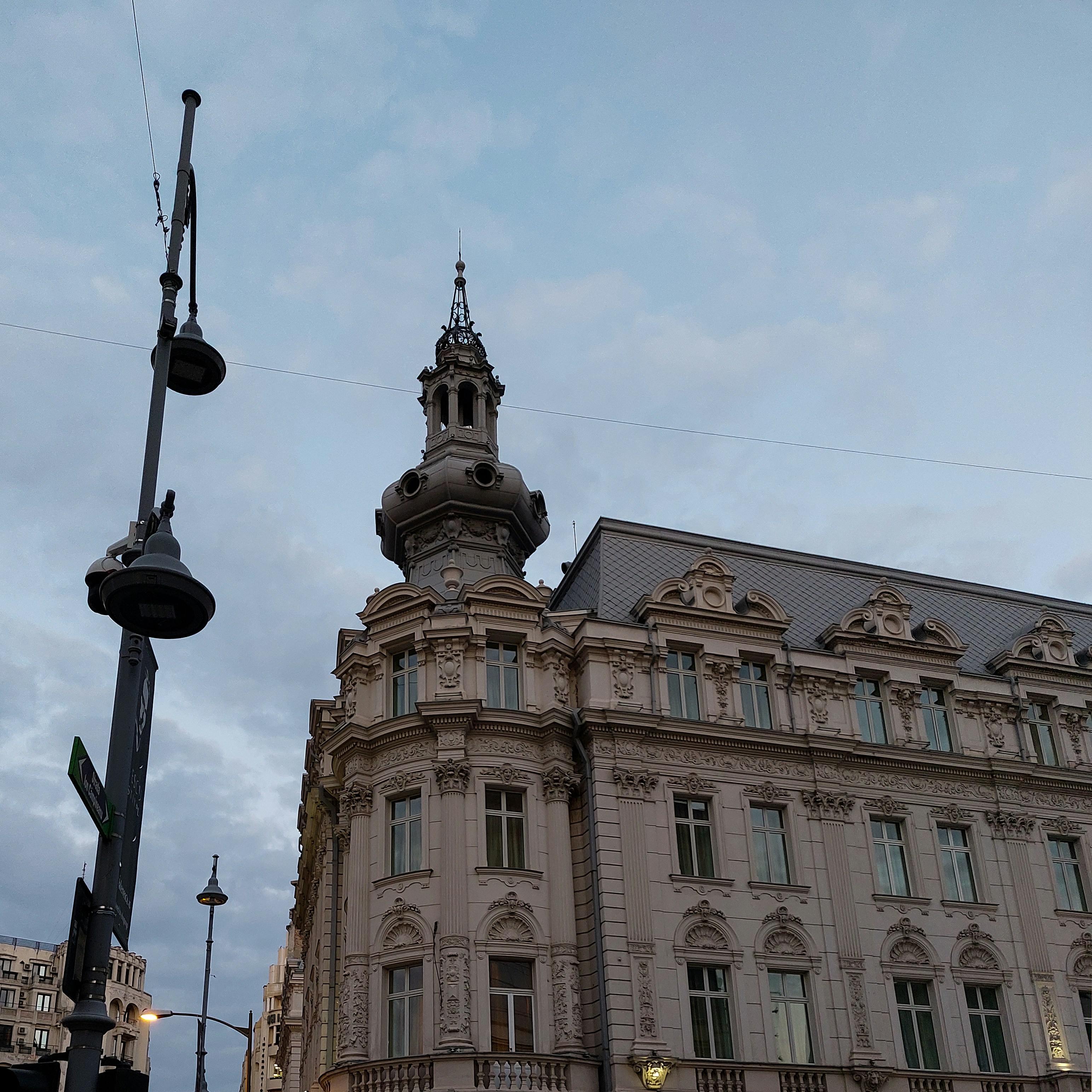 A tall building with a clock on the top of it photo – Free Art Image on ...