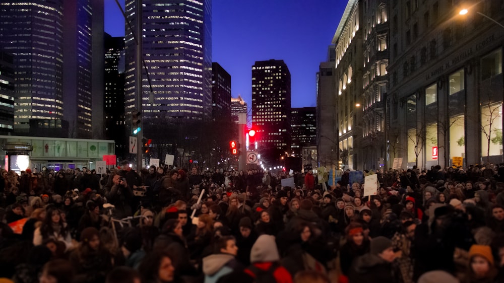 a large group of people standing on a street