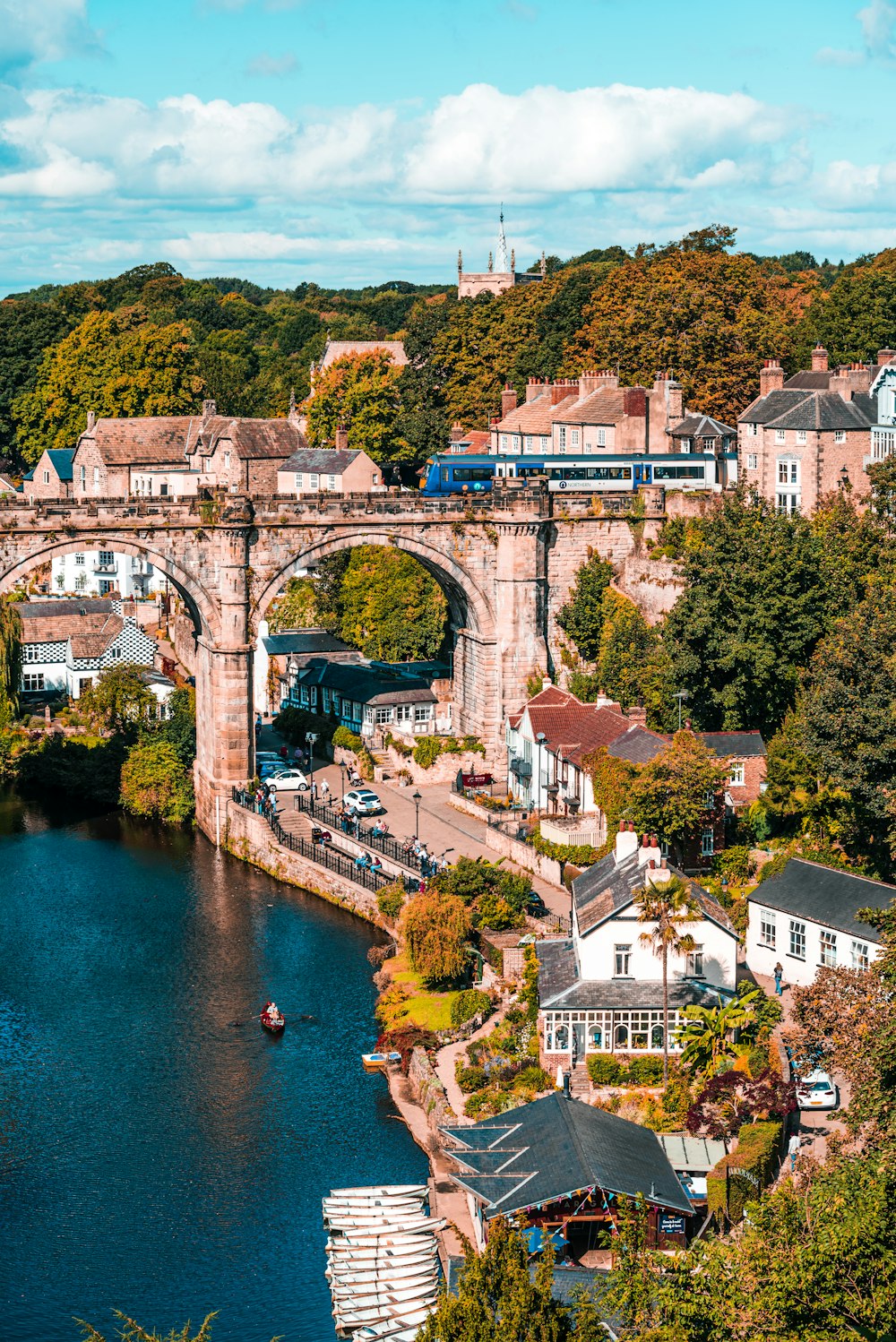 a bridge over a river with a train going over it